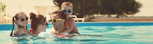 Happy-family-in-swimming-pool